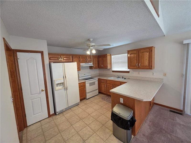 404 Blue Grass Dr, Raymore, MO 64083