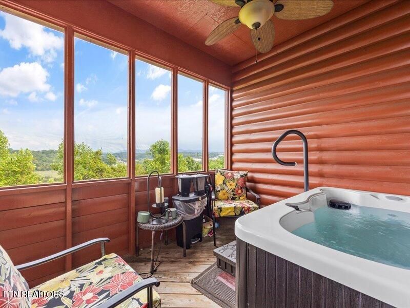 Screened porch with a custom hot tub at 2044 Hickory Ridge Way #3334, Sevierville, TN