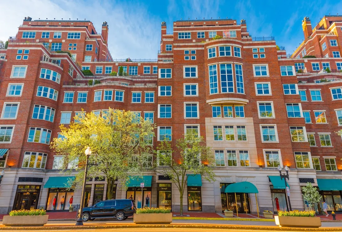 Brick architecture and street-level shops at Heritage on the Garden in Boston