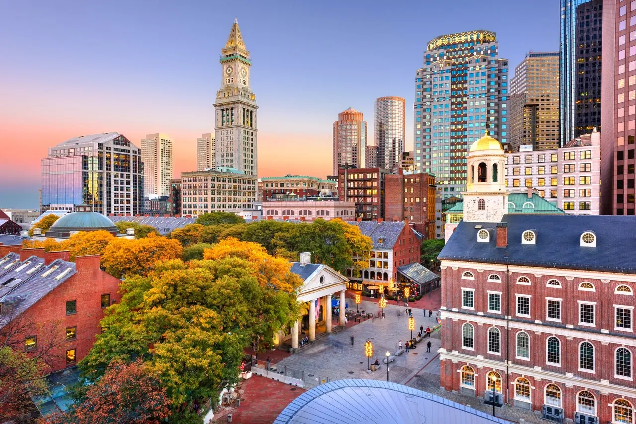 Boston's Custom House tower and downtown skyline above Quincy Market