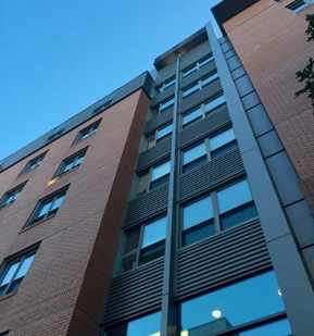 Legacy exterior photograph of James Court showing brickwork and tall windows