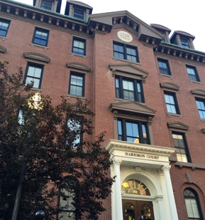 Legacy photograph of Harrison Court’s brick facade and signed entrance