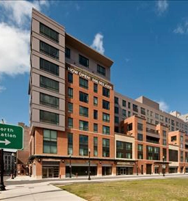 Legacy exterior photograph of Avenir Apartments at the Canal Street corner