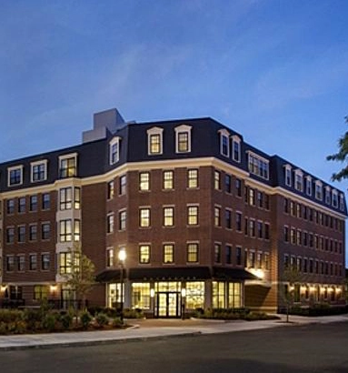 Legacy exterior photograph of Gatehouse 75 at dusk