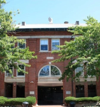 Brick facade and arched entrance of The Anchorage Apartments