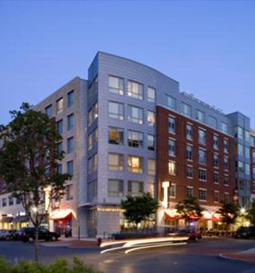 Exterior of the former Arborpoint at Station Landing rental buildings with ground-floor storefronts
