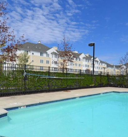 Legacy photograph of the pool and residential buildings at Wellington Place