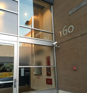 Glass entrance and number 160 at East Berkeley Lofts