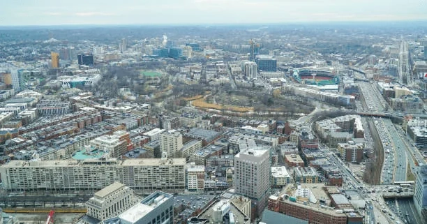 Aerial view of Fenway buildings, streets, parkland and the ballpark