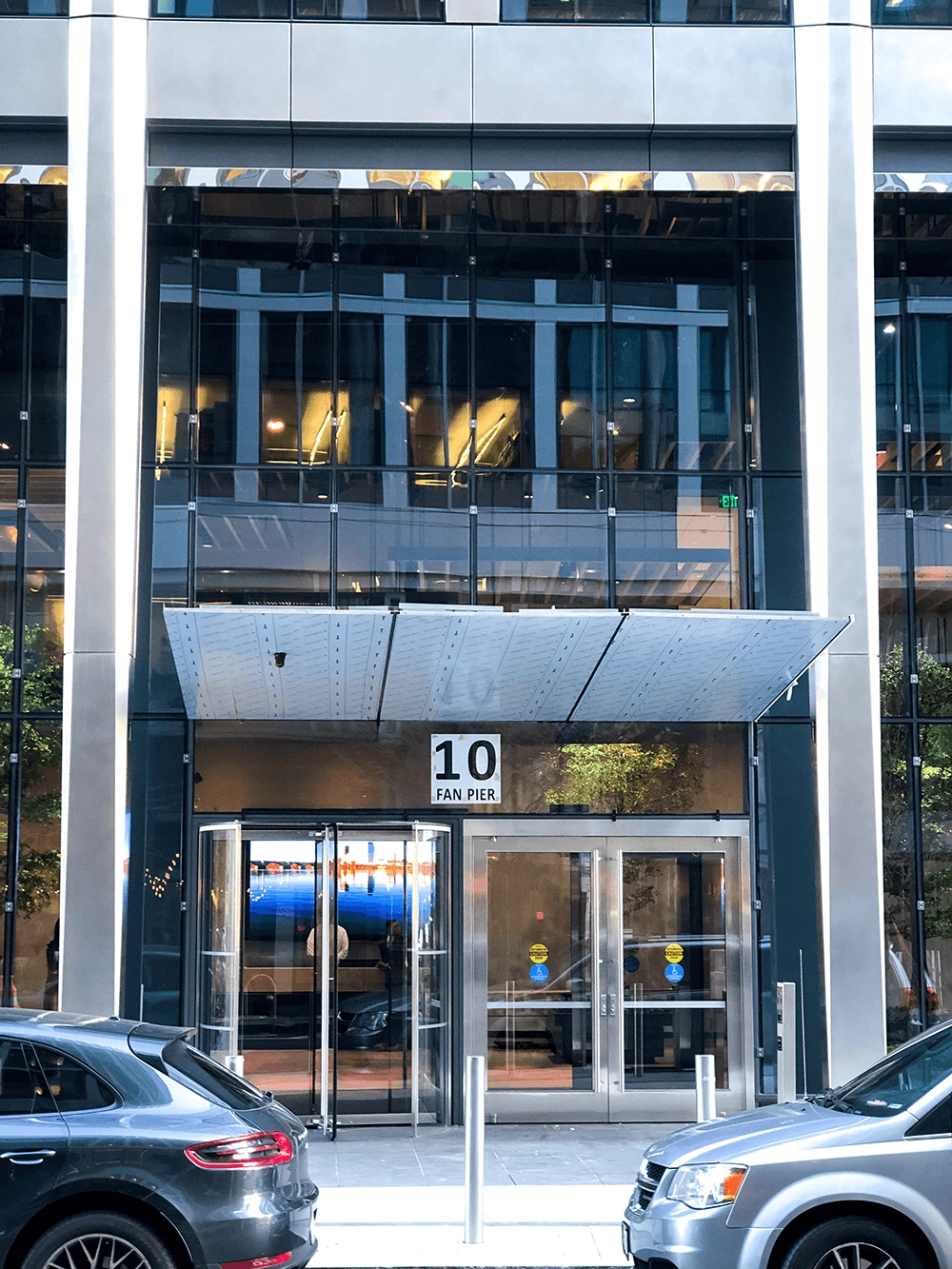 Glass entrance with a visible 10 Fan Pier sign.