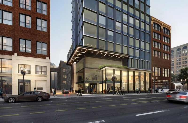 Architectural rendering of a proposed glass-fronted building between brick buildings.