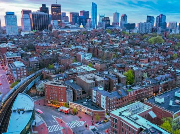 Urban rooftops, rail track and skyline.
