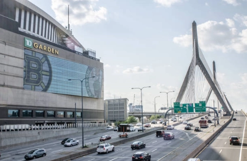 TD Garden facade, roadway and cable-stayed bridge.