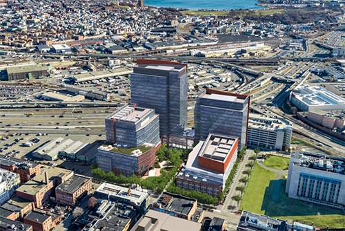 Aerial architectural illustration of towers and landscaped spaces.