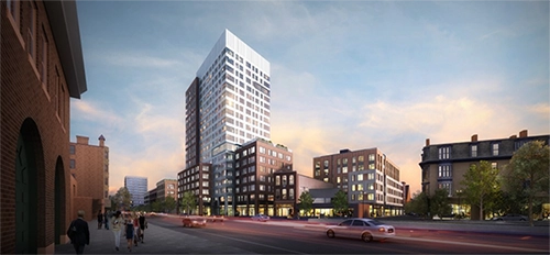 Rendering of a residential tower and surrounding buildings at dusk.