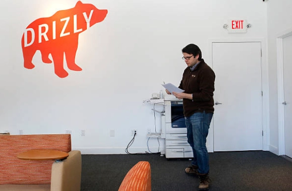 Drizly-branded office interior in the historical headquarters report