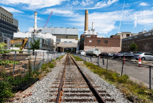 Rail tracks and industrial buildings in the historical market article