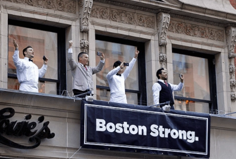 Restaurant facade and Boston Strong banner in the historical proposal article