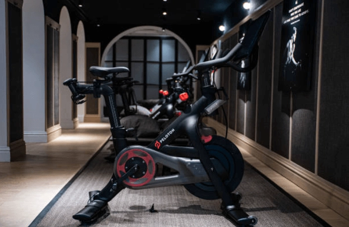 Peloton-branded exercise bicycles in an indoor room