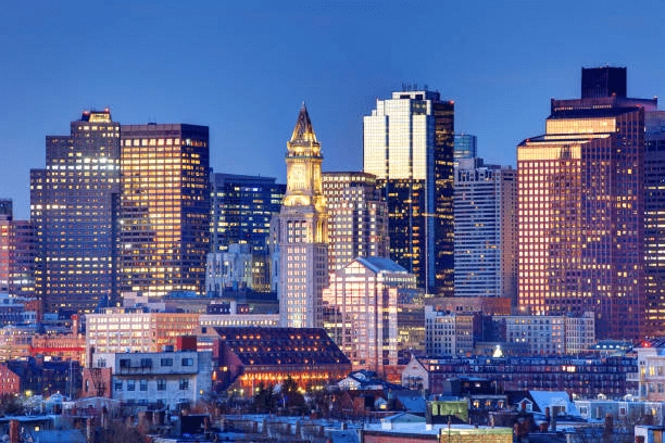 Illuminated city buildings at dusk