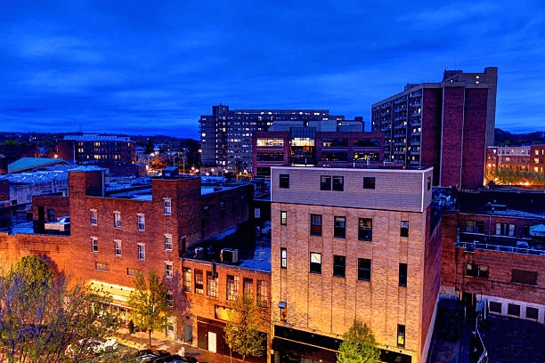 Brick and high-rise buildings in an evening city view
