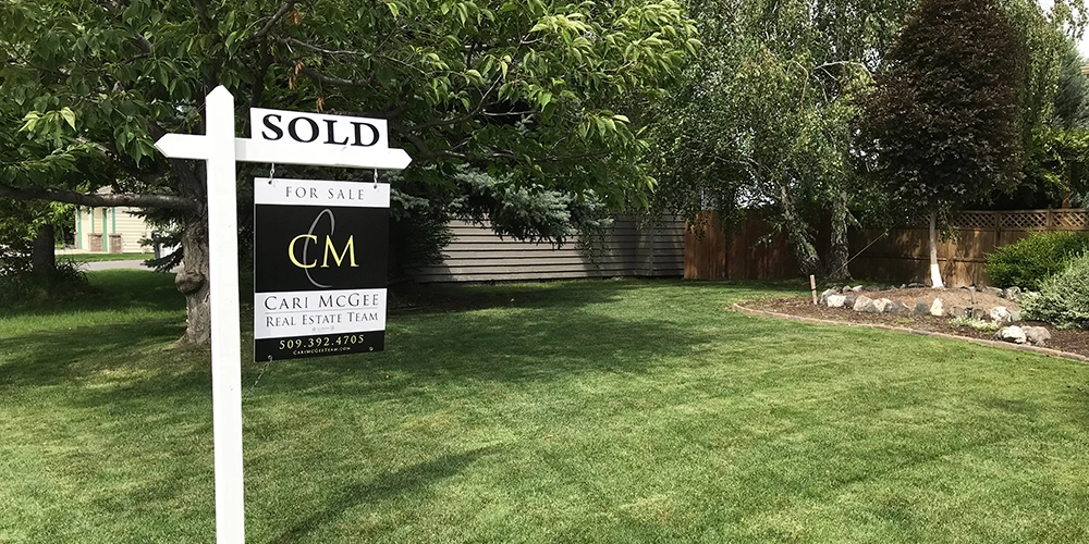 Cari McGee Real Estate Team "Sold" sign