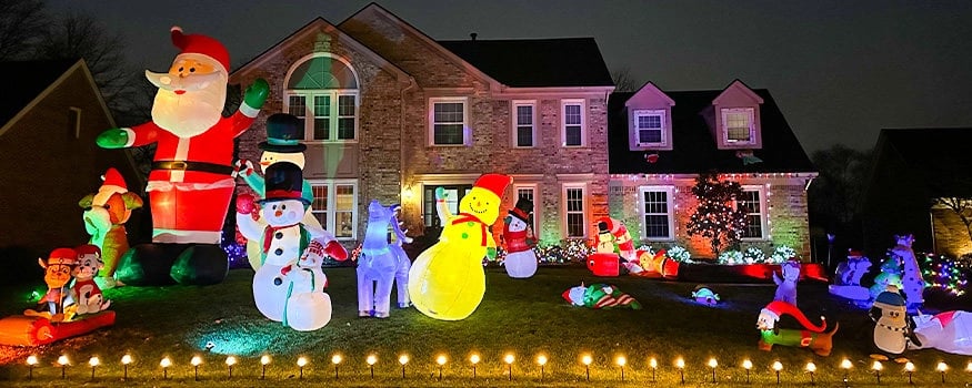two story home in The Woods of St Thomas with christmas display