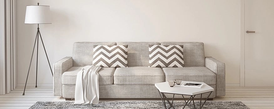 picture of a couch and table in staged living room
