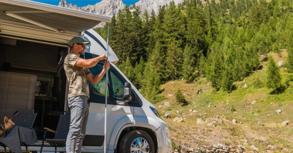 Camper awning installation using tools, highlighting the steps involved in setting up a camper awning