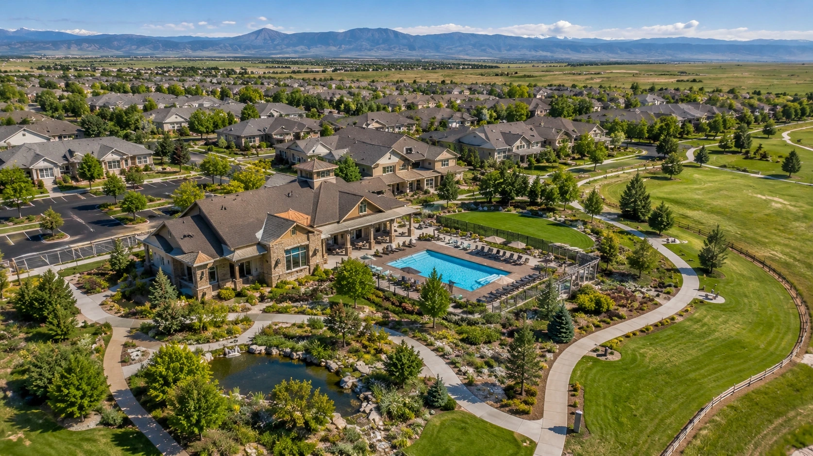 Aerial view of a 55+ community in the Denver metro area with clubhouse and walking trails