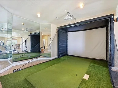 Indoor golf simulator room at 35880 E 149th Court, Hudson, CO
