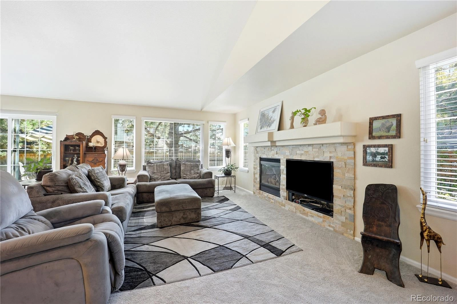 Great room: vaulted ceiling, gas fireplace, a wall of windows