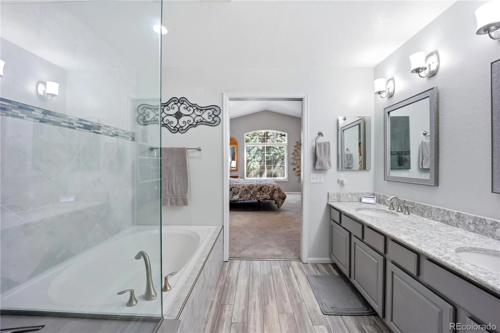 Primary bath: double vanity, walk-in shower and soaking tub