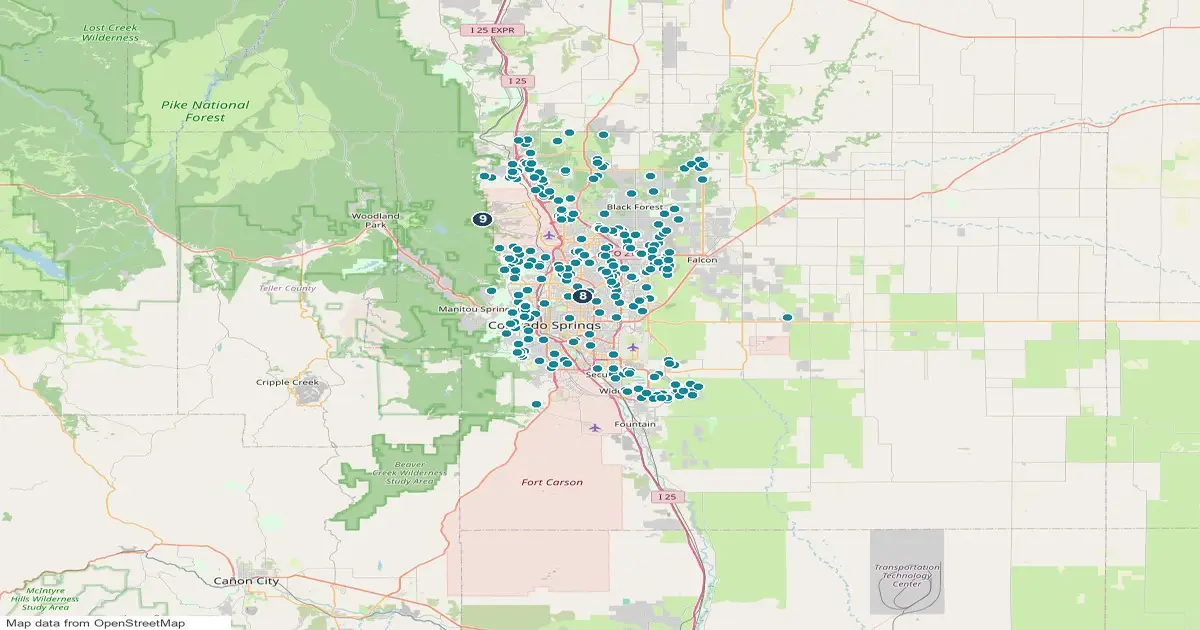 Map of the Colorado Springs area, Colorado, showing 2 major parks and open spaces as numbered pins and 309 homes for sale whose listings name open space as teal dots