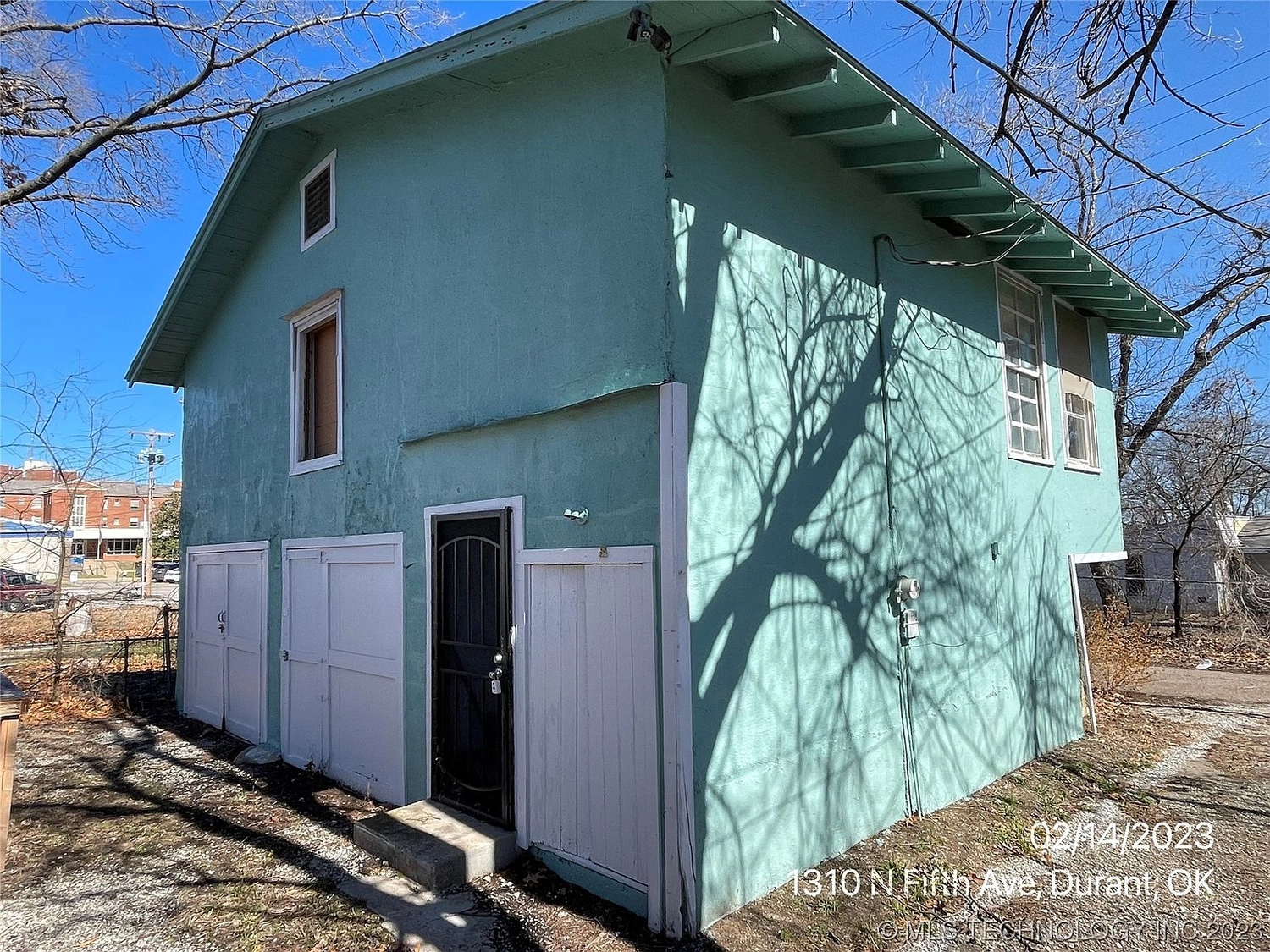 Side of house at 1318 N 5th Avenue #1/2, Durant OK – view 2