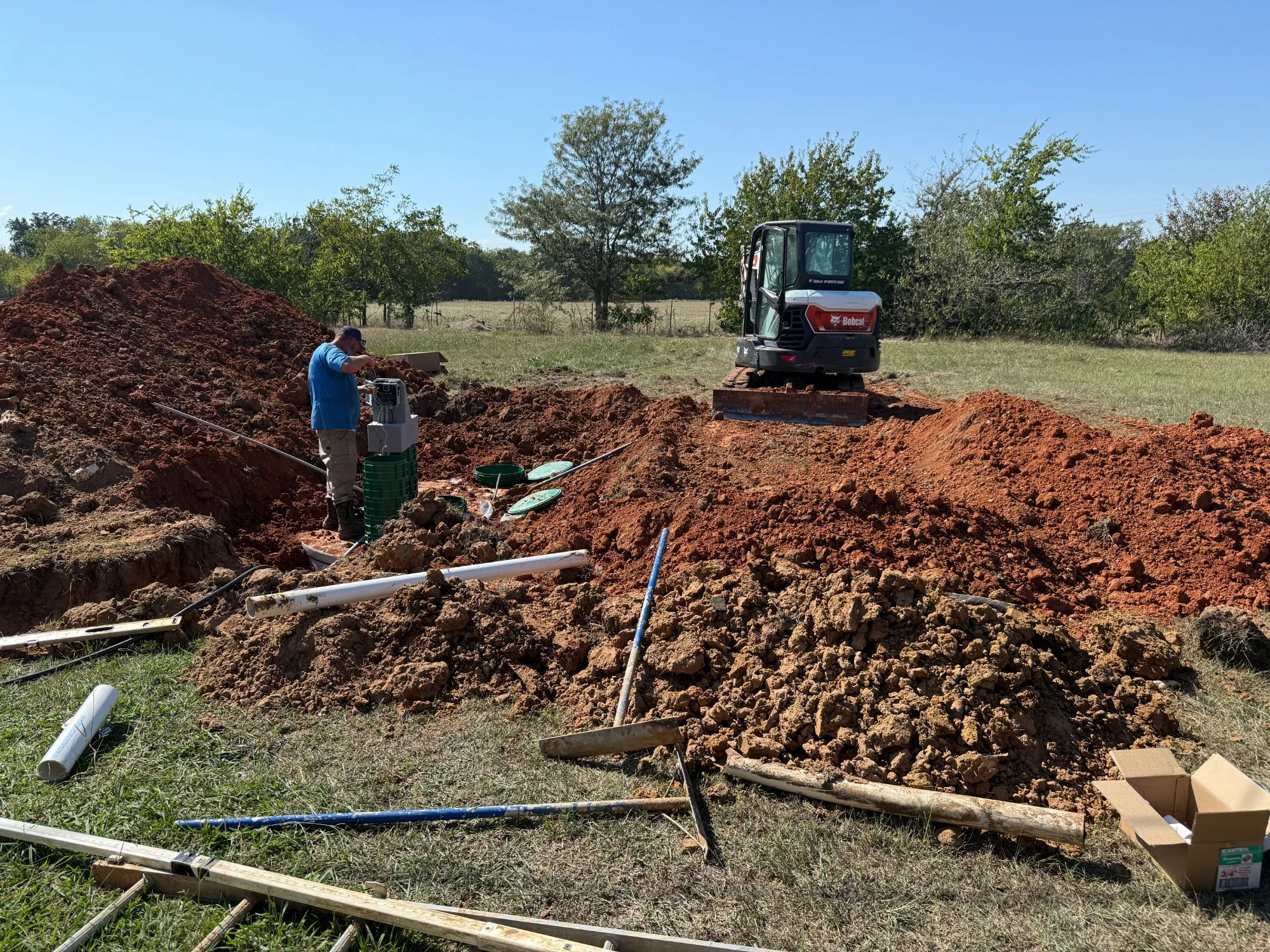 1682 Lemonhill Rd, Calera, OK – excavator and new septic tank during the move