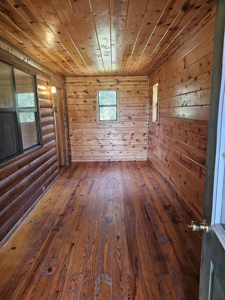 Pine-paneled interior room at 3282 Rock Creek Rd, Sawyer, OK