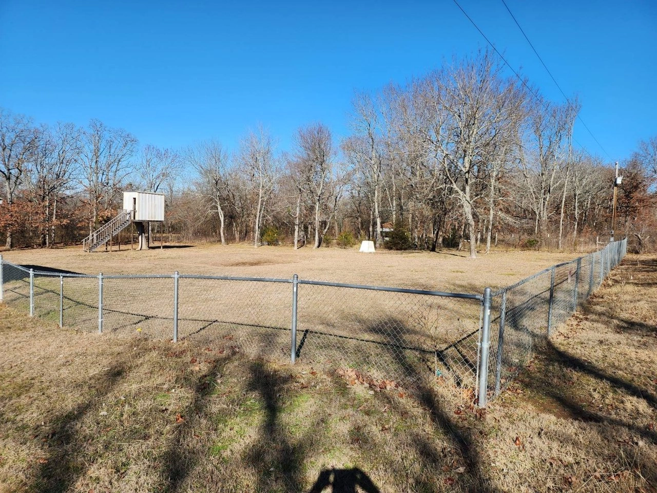 Fenced yard with trees at 3177 Rock House Rd, Bennington, OK