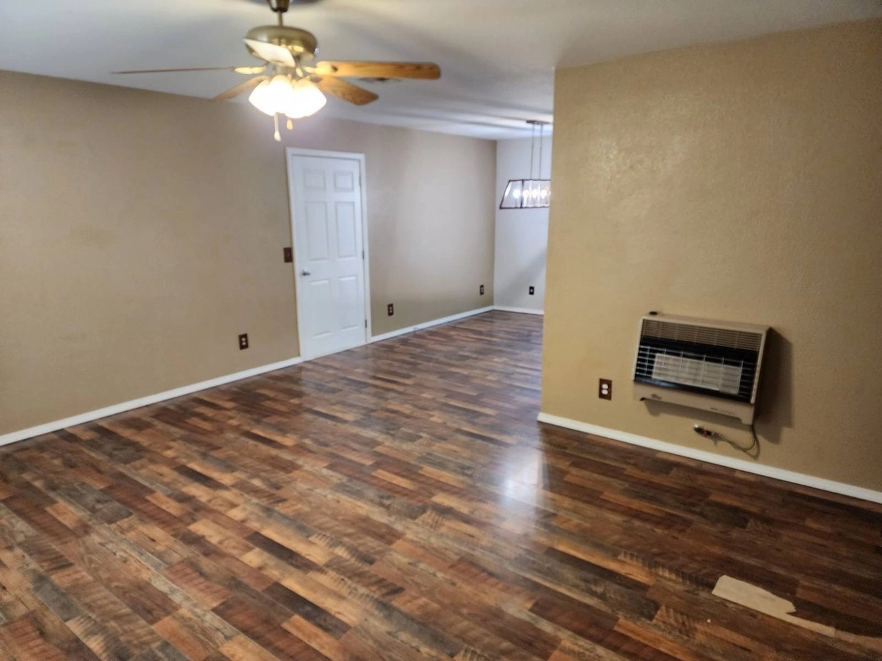 Living area with wood-look flooring at 3177 Rock House Rd, Bennington, OK