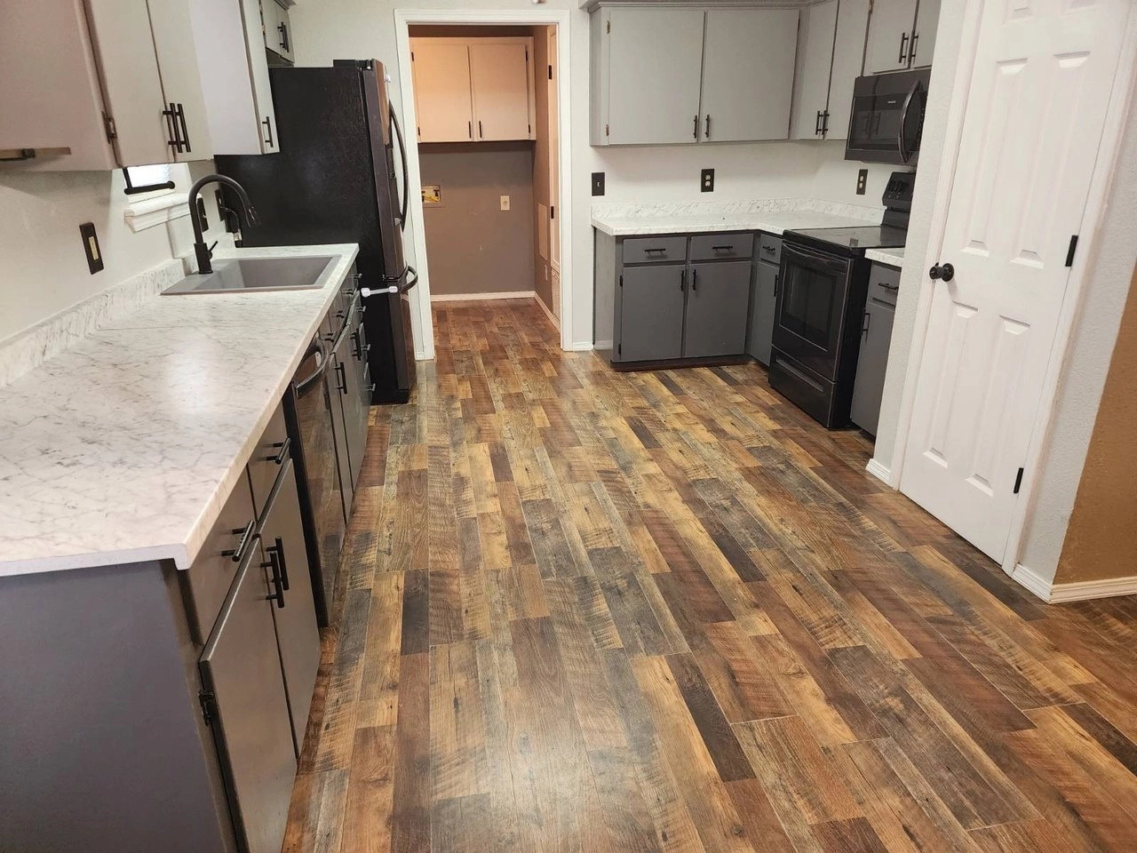 Kitchen with light countertops and gray cabinets at 3177 Rock House Rd, Bennington, OK