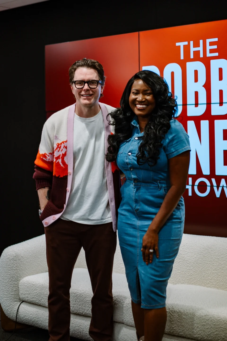 Britany at The Bobby Bones Show studio, pictured with another person