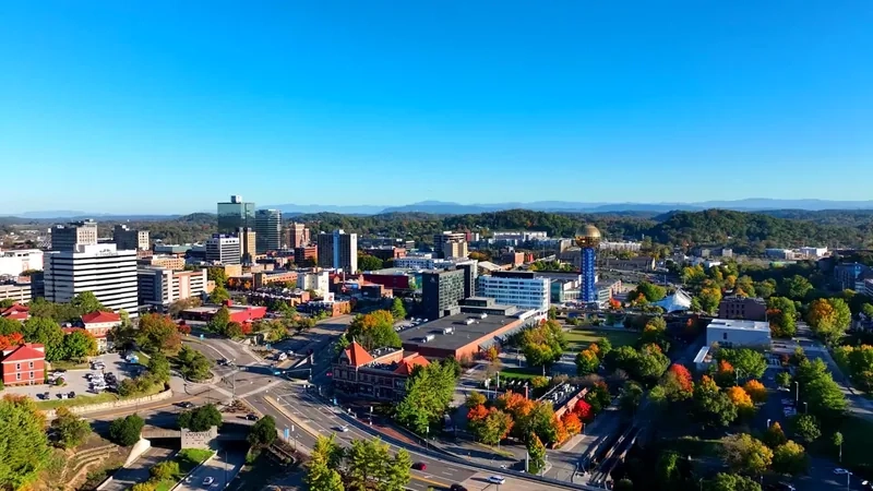 Knoxville's Sunsphere and downtown, with wooded hills beyond