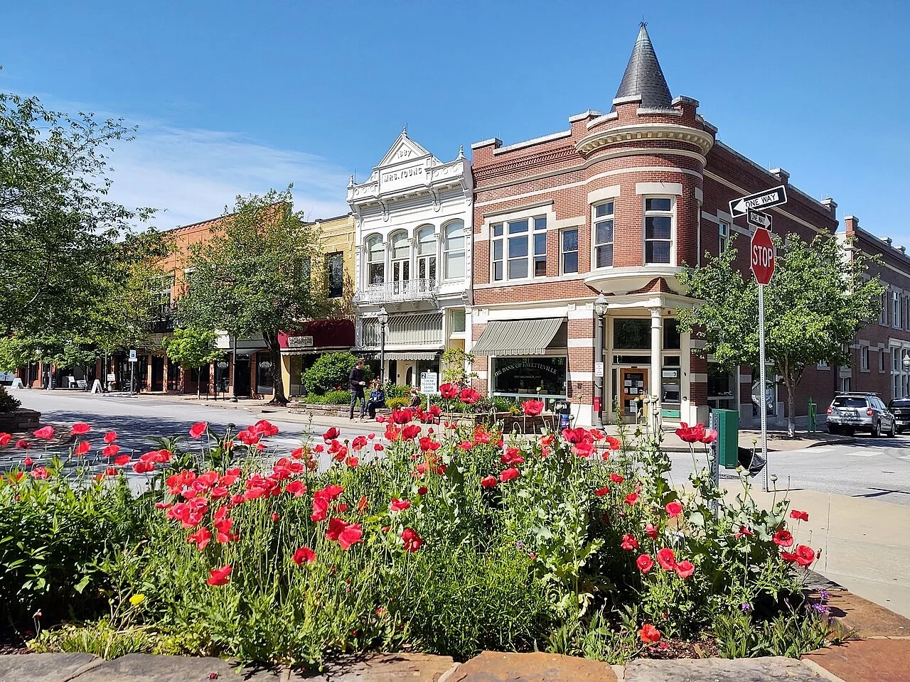 Flowers and historic storefronts on Fayetteville Square, Arkansas
