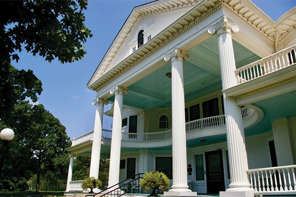 view of the large second-story porch on the seelye mansion