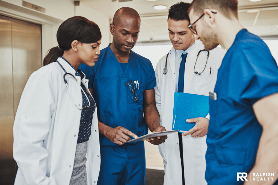 Medical and healthcare professionals standing together with doctors and nurses