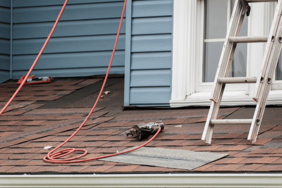 Residential Roof Replacement with ladder and materials