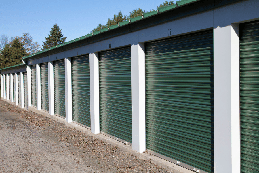 outdoor storage facility with green doors and green roof