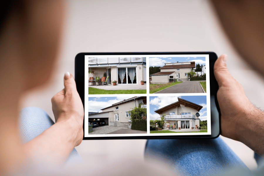couple looking at professional real estate photos online of home for sale