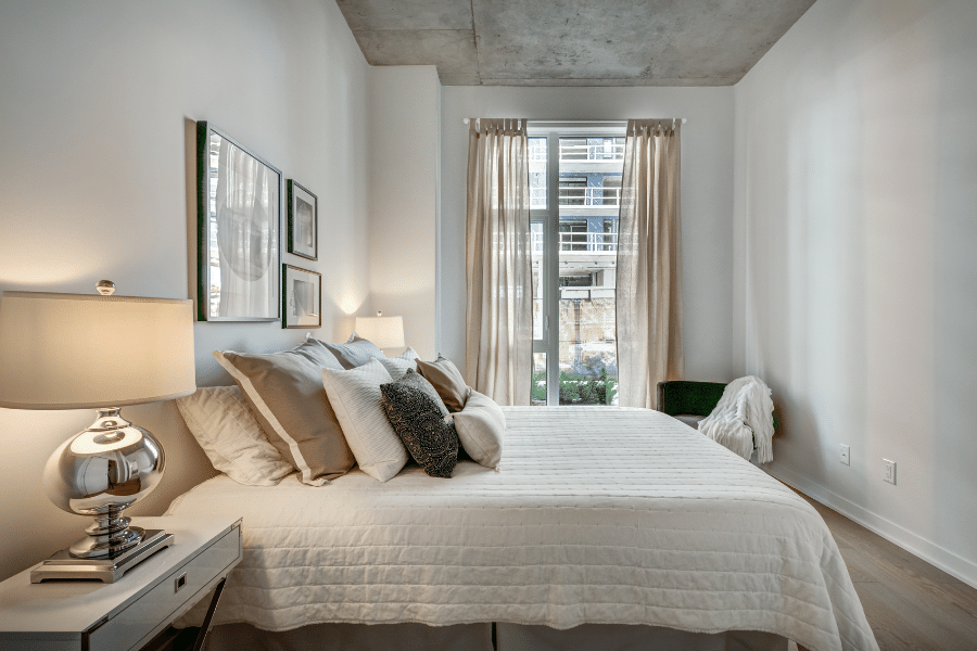 bedroom in apartment with white walls 