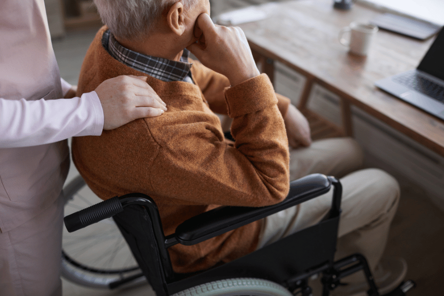 senior man in wheelchair at a retirement home